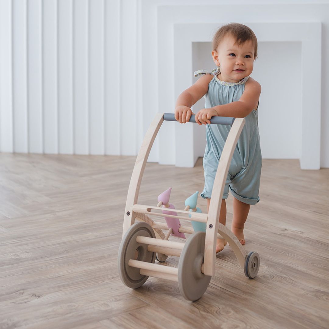 Child pushing the Woodpecker Walker