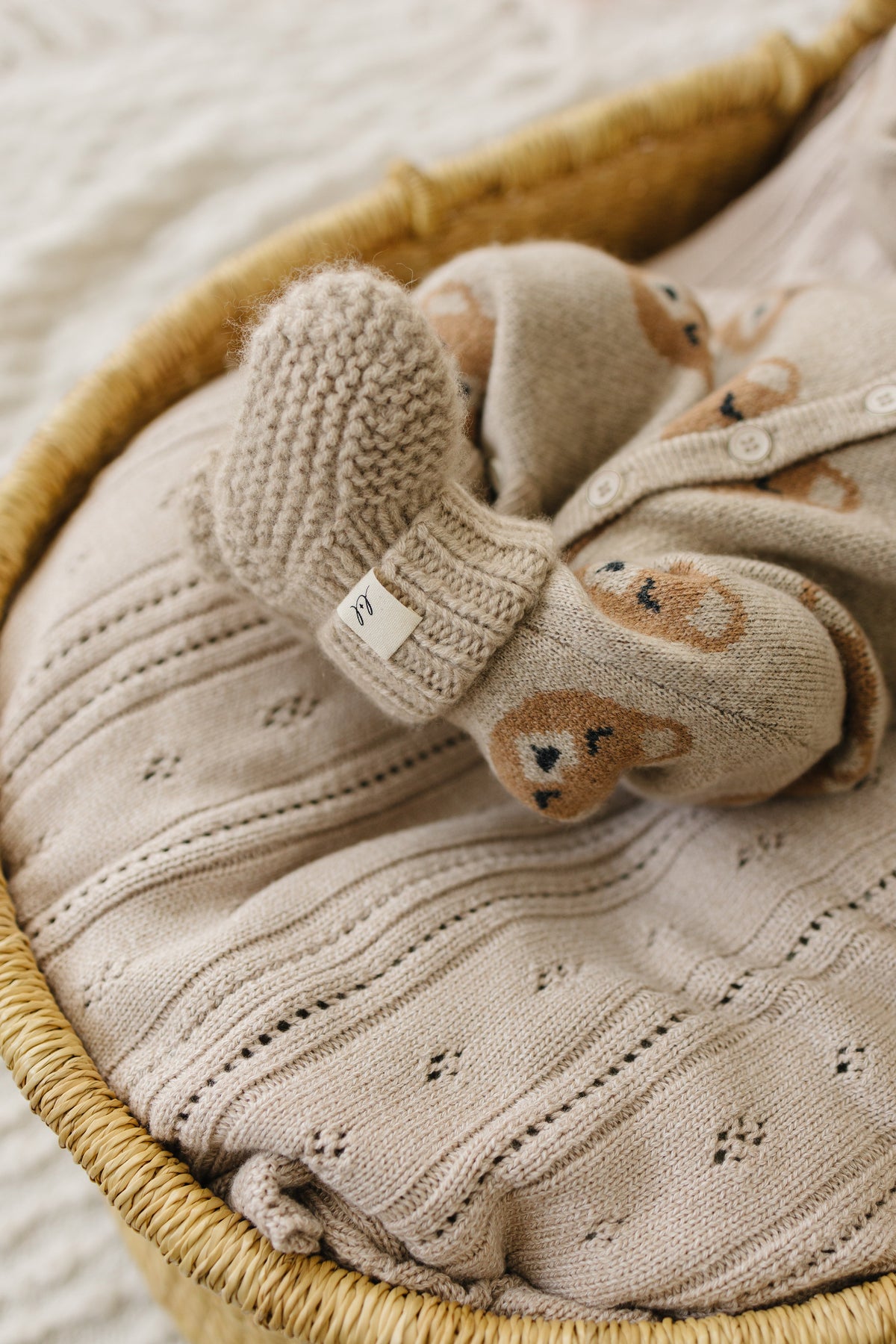 The booties and bonnet in heathered brown cashmere