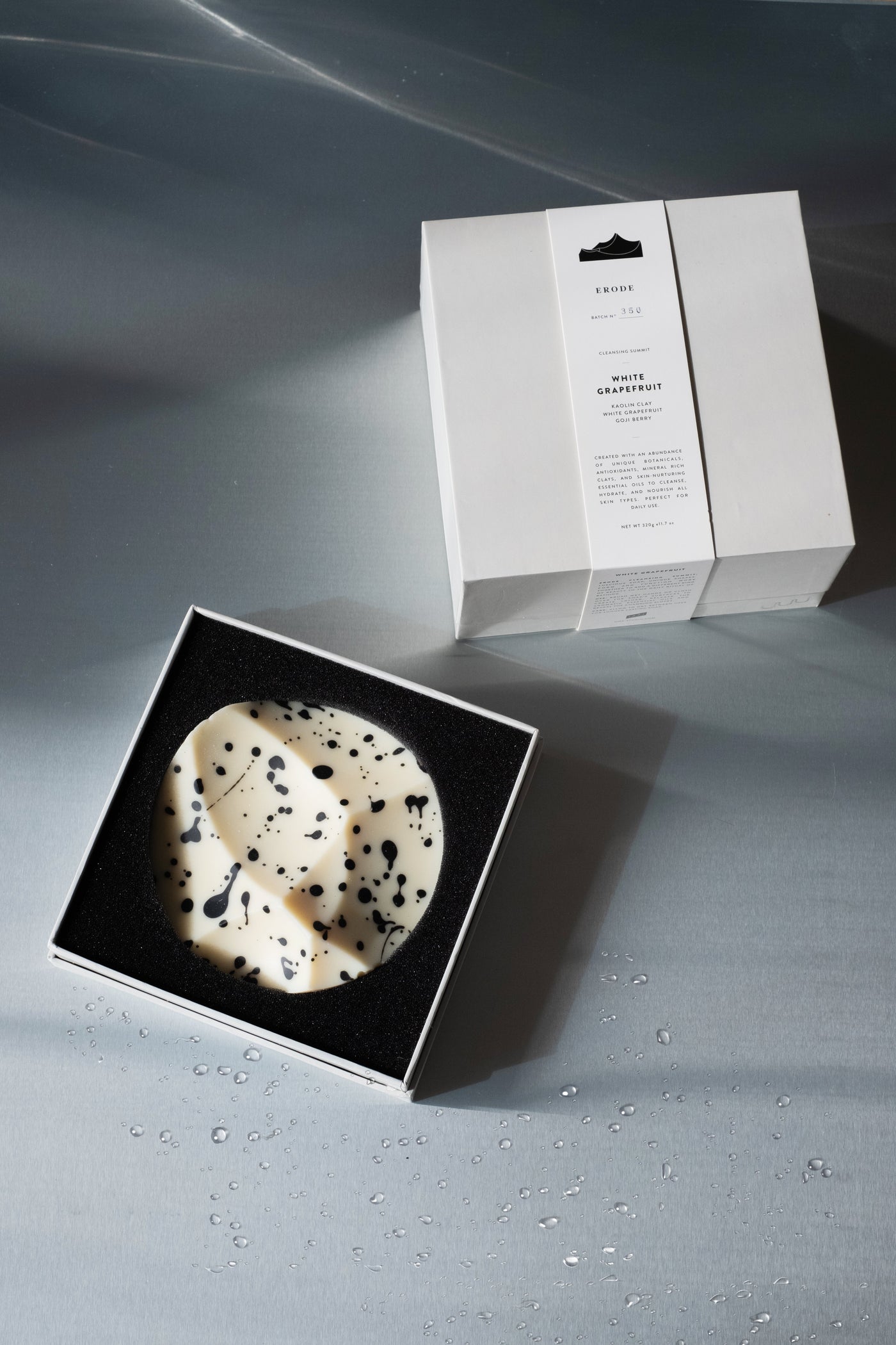Erode Soap in White Grapefruit, the sculptural bar on a pale dish