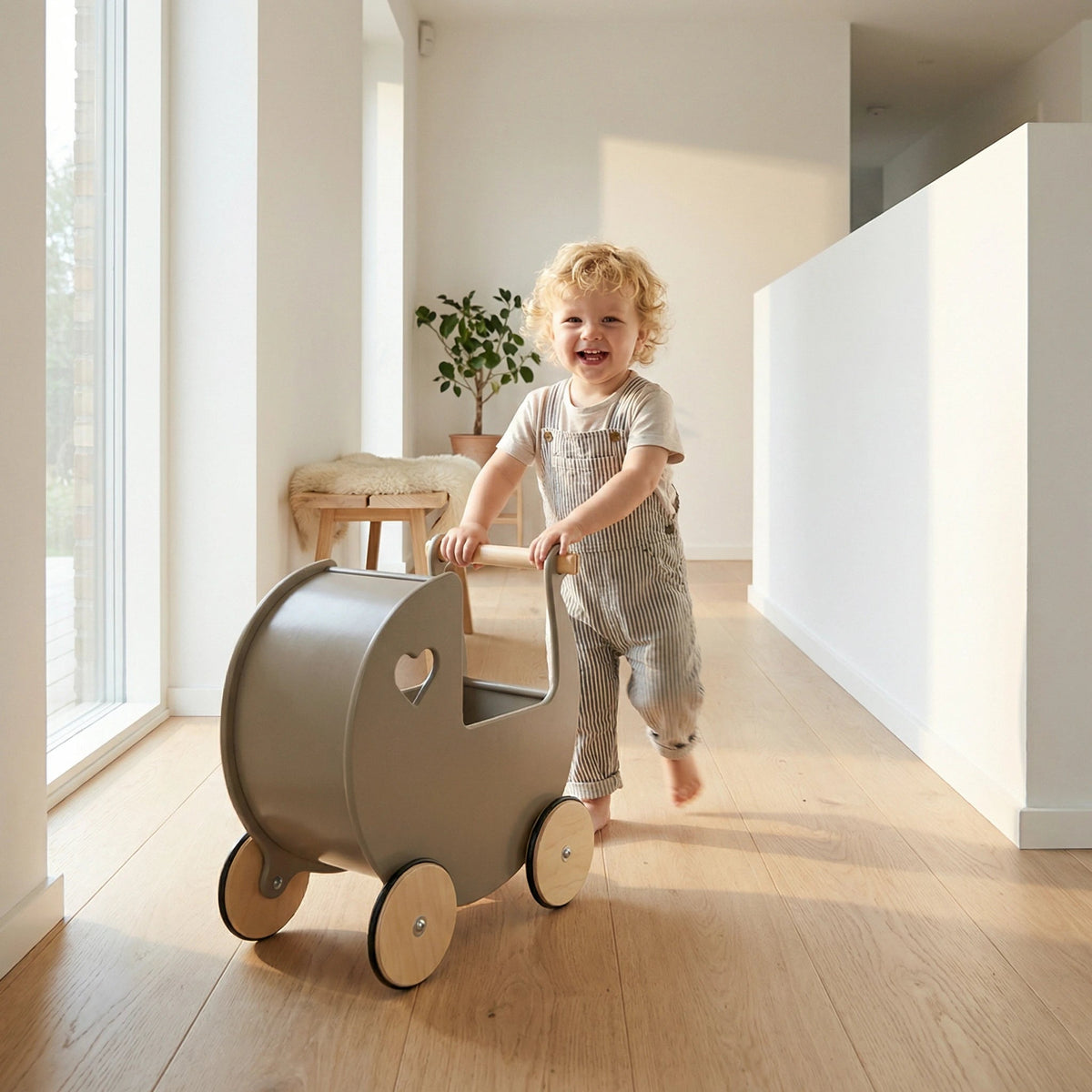 Child pushing the Moover doll stroller