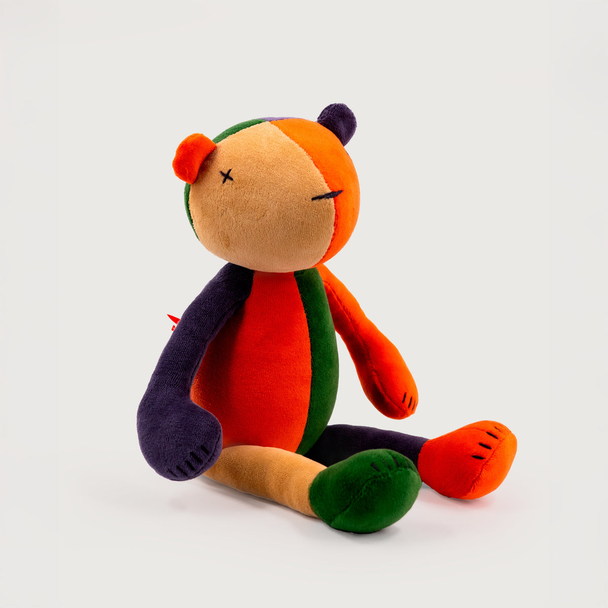 The One, ADADA Jermaine the Bear in multicolor, seated