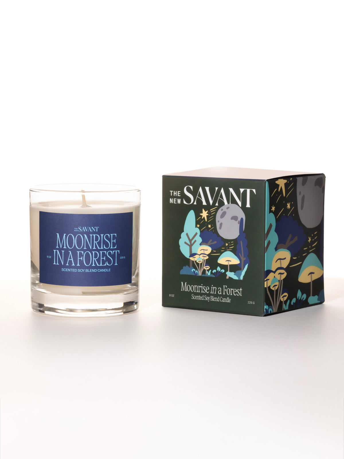 The New Savant Moonrise in a Forest Candle in glass beside its illustrated box