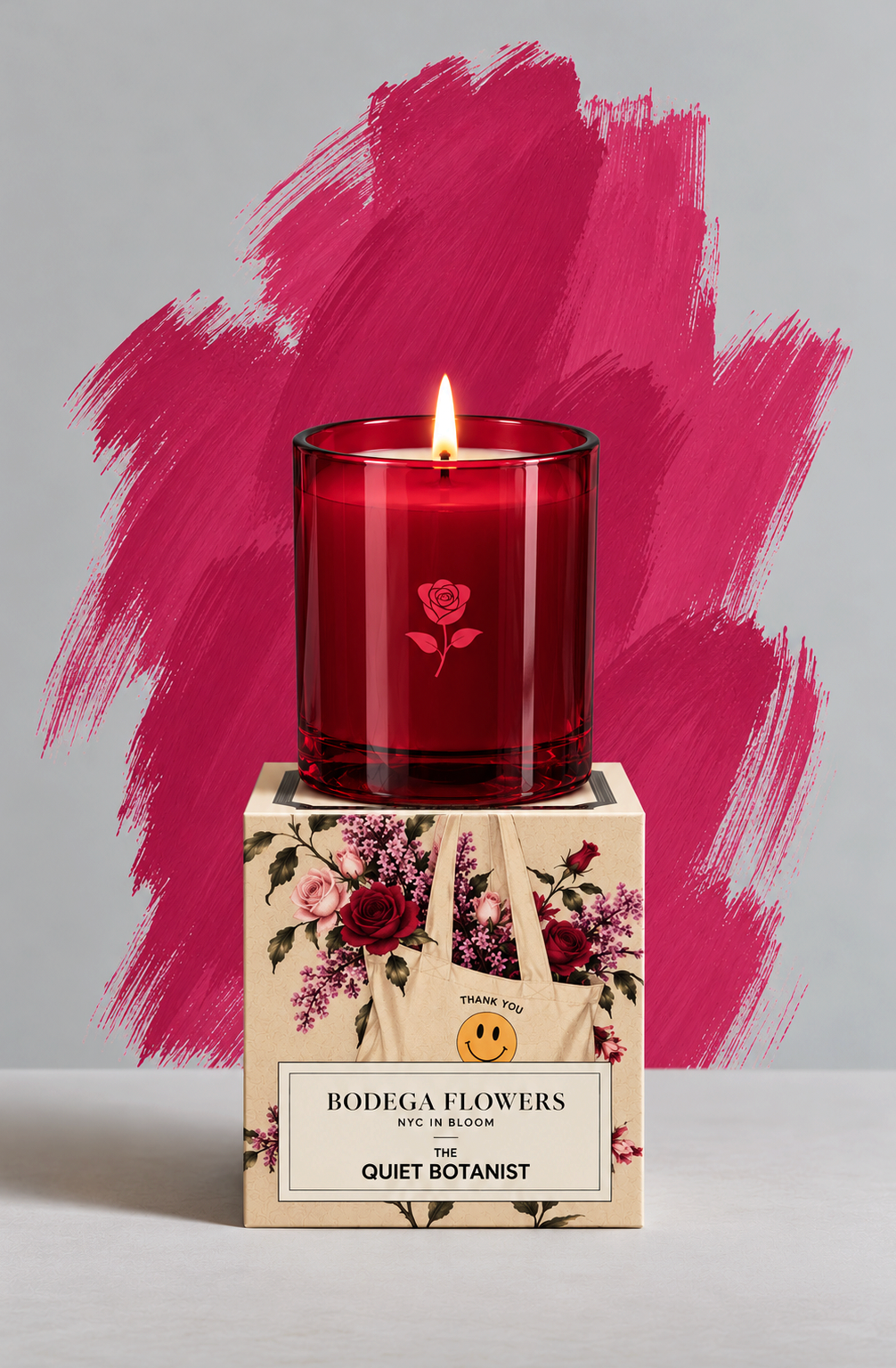 The Quiet Botanist Bodega Flowers candle, lit, in red glass