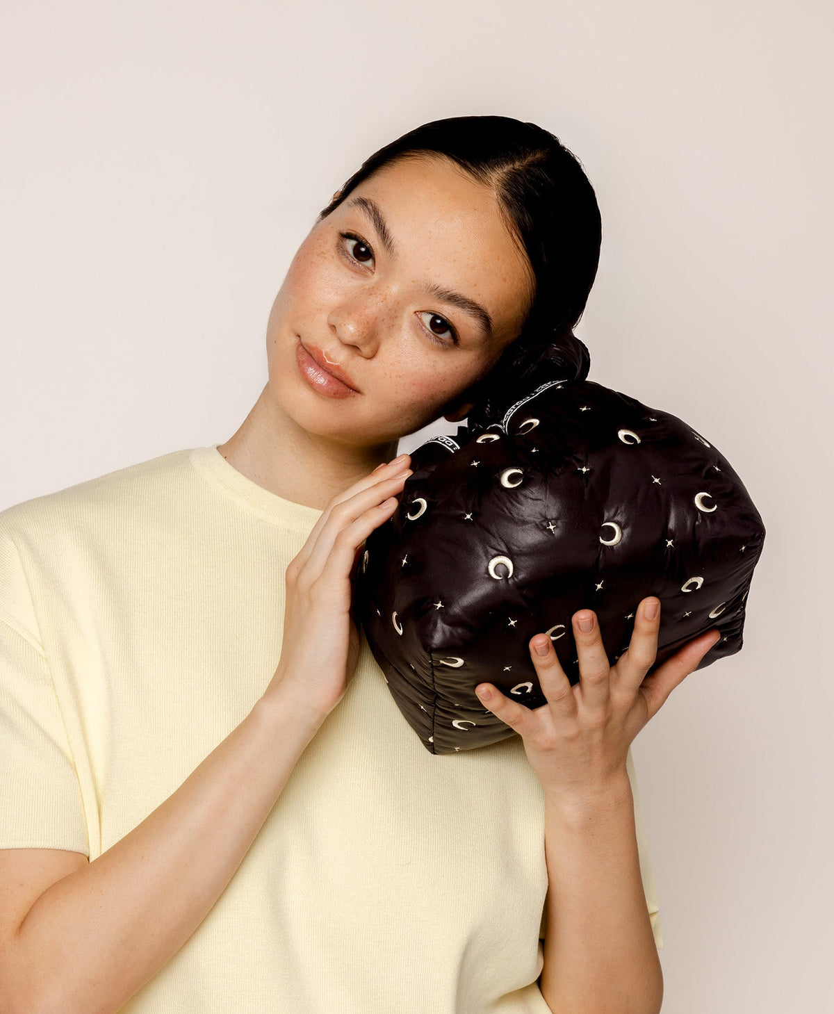Caraa Lunch Pouch in Black Moon and Star held up close