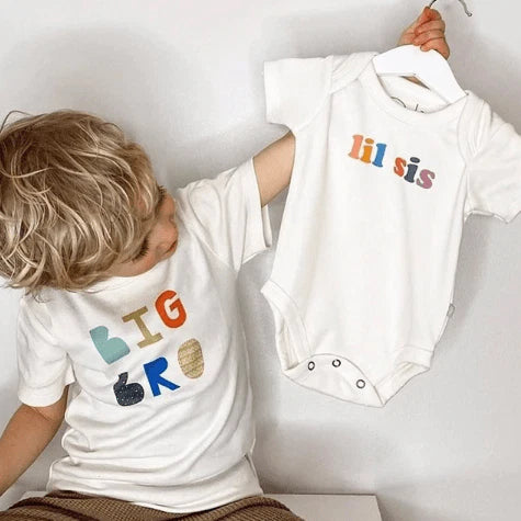 The Big Brother Edit with Finn and Emma Big Bro tee, matching bodysuit, picture book, and cuddle and kind Noah the Dog